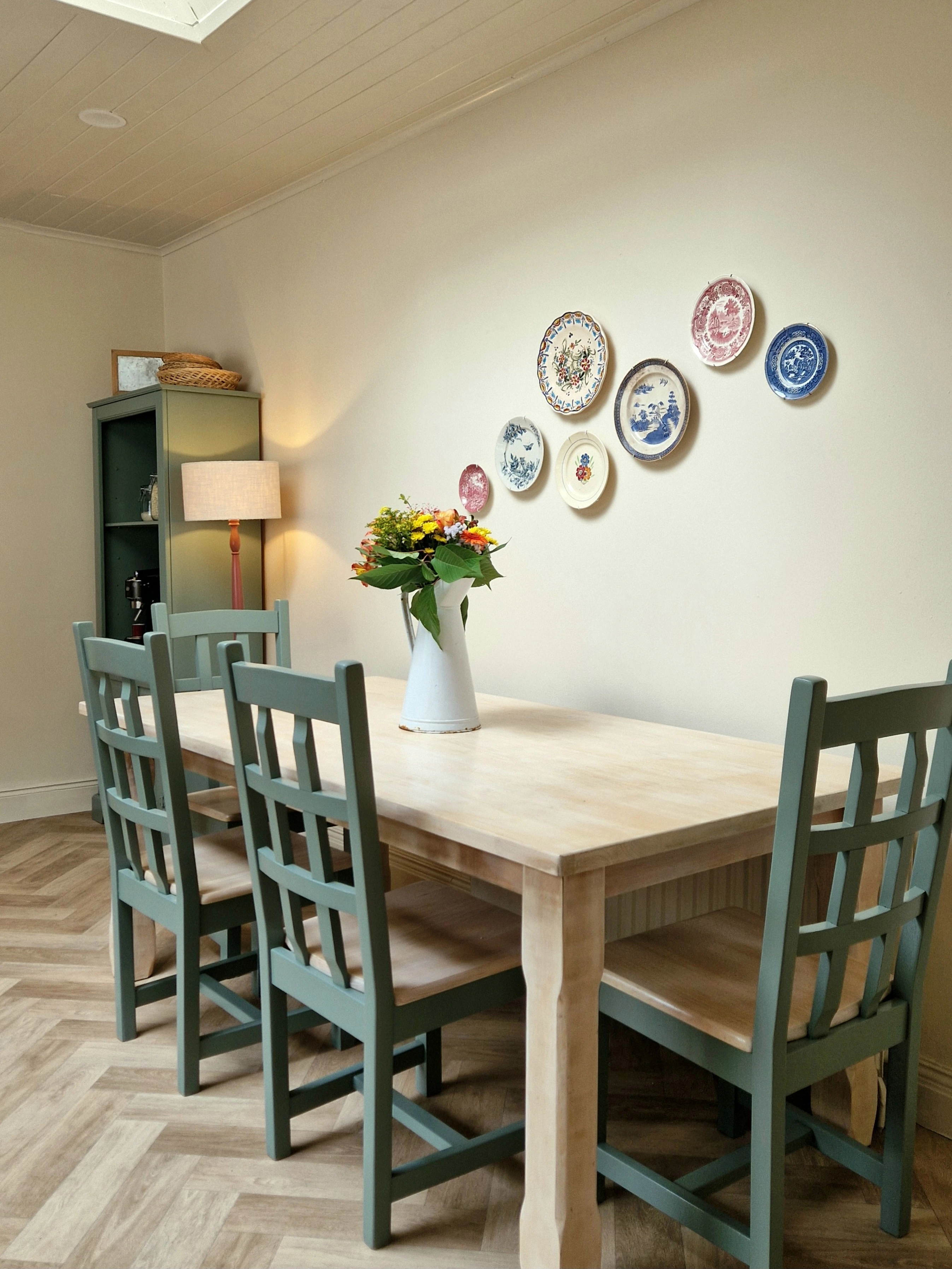 In a recent episode of Salvage Squad, Cathy Angelini led the transformation of a pine kitchen to a chic new-look space. Cabinets were painted an earthenware colour, a new pale wood stain was put on an old pine table and kitchen chairs were refreshed with a subtle sage green paint.