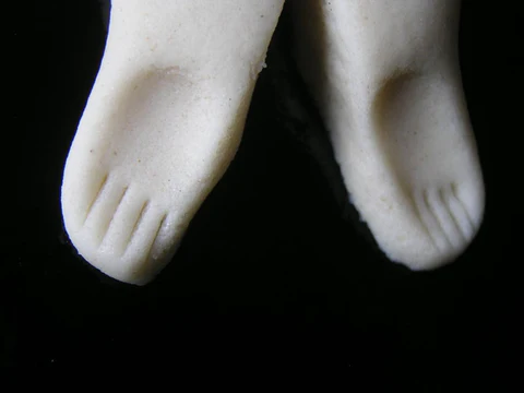 Dough manipulated into the shape of two feet